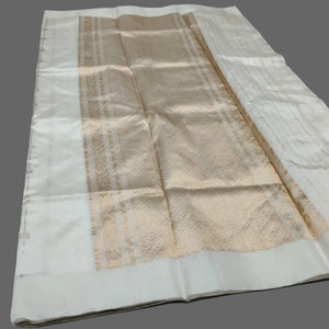Folded fabric with beige and white pattern on a white background