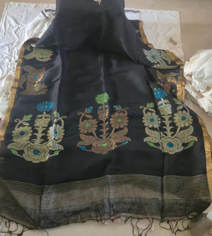 Black saree with floral embroidery on a white background