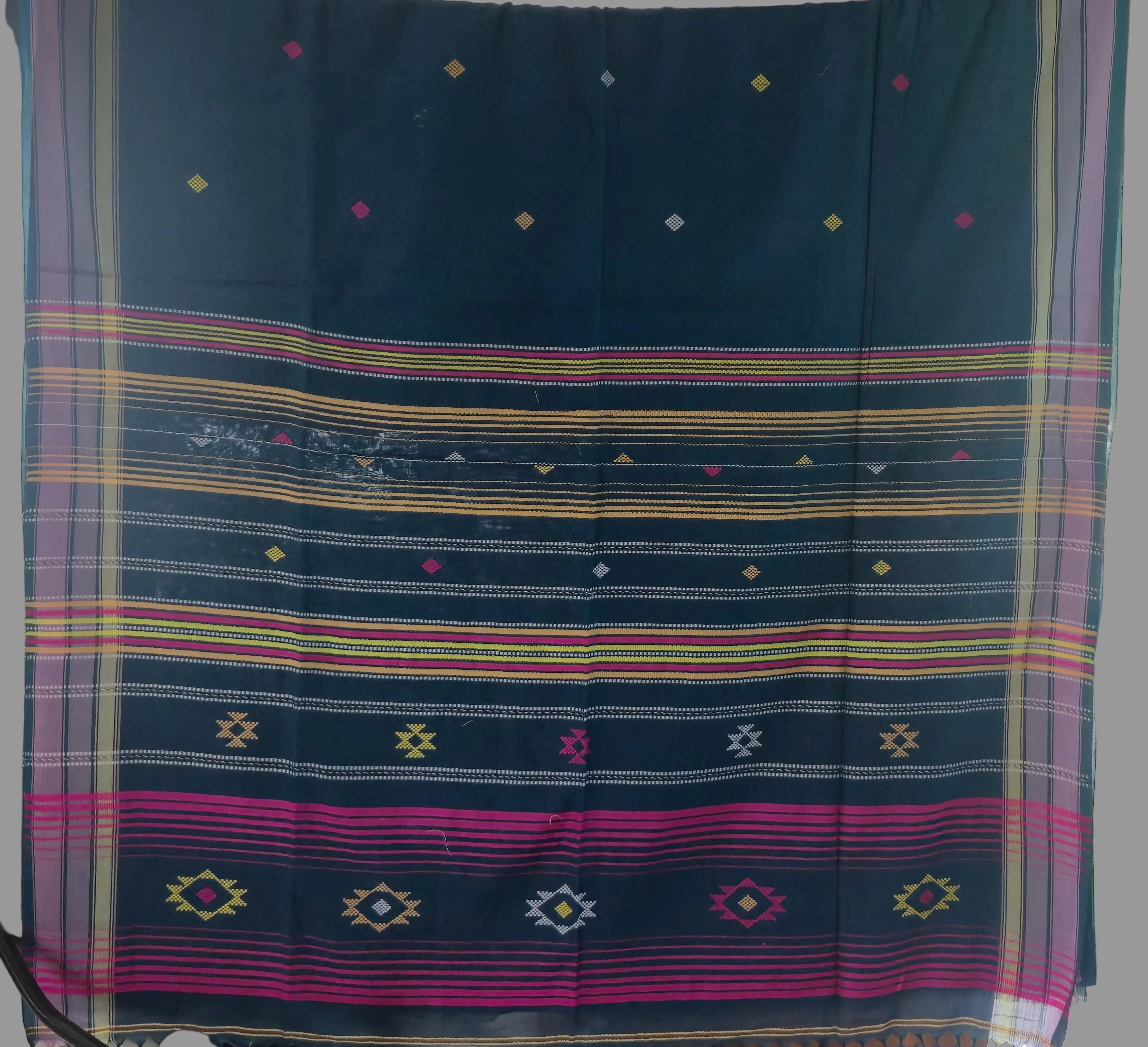 Traditional fabric with colorful patterns on a dark blue background