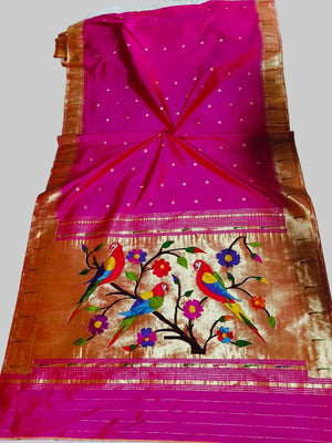 Saree with colorful bird and flower design on a pink and orange background