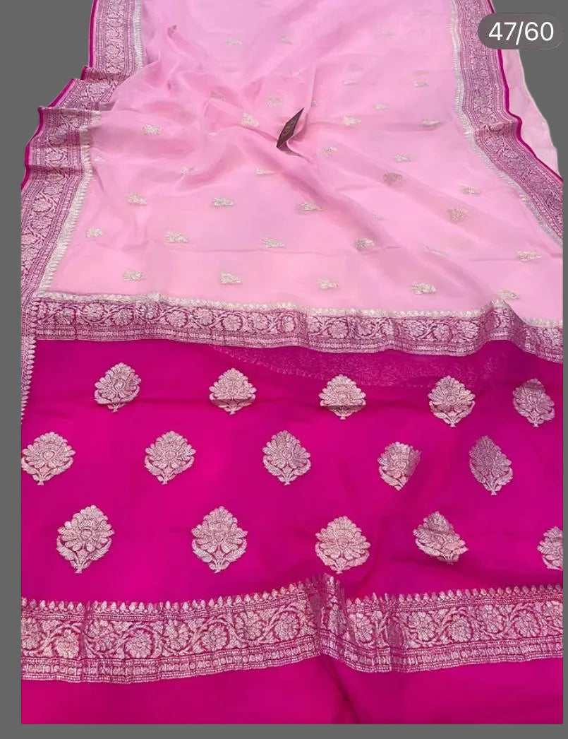 Pink saree with white floral patterns on a white background